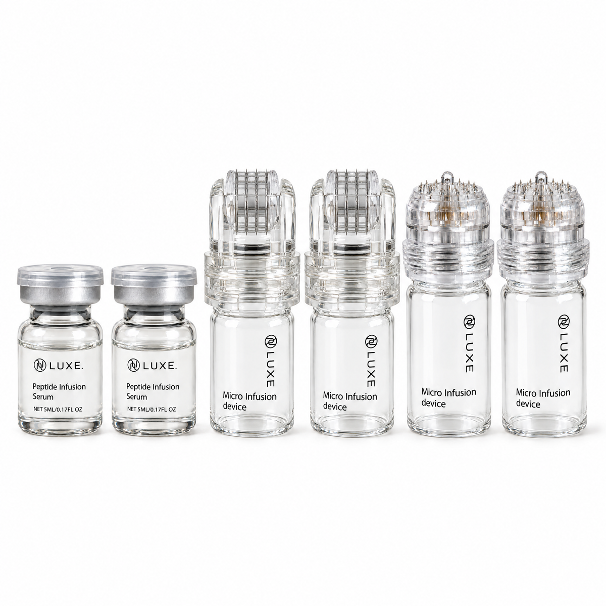 What is in every LUXE Micro-Infusion Kit box: two serum vials, two roller heads and two stamp devices, on white